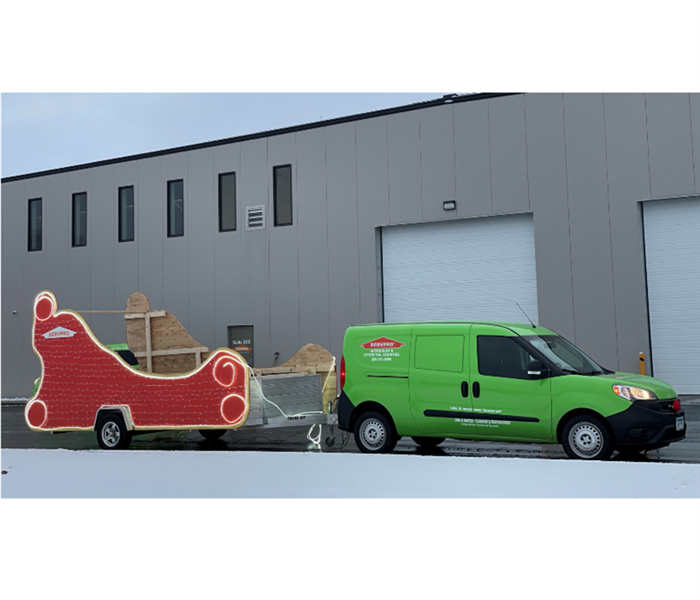 Servpro van with santa sleigh in back