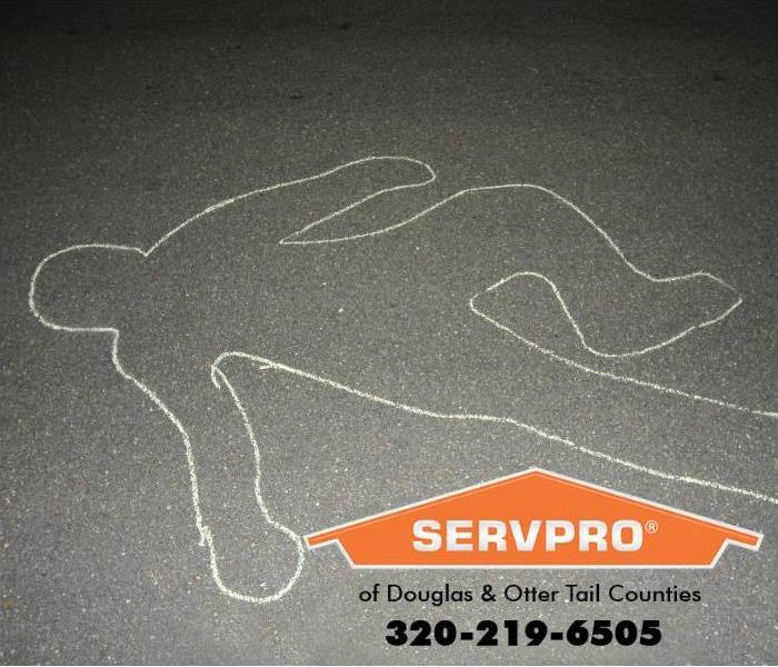 A chalk outline of a body is shown. 